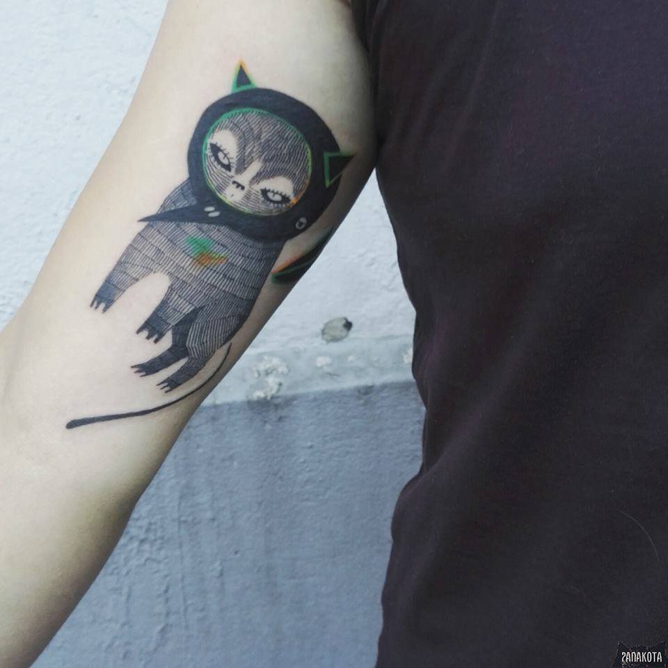 Impressive Black Ink Cat Tattoo On Right Bicep By Panakota
