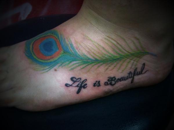 Life Is Beautiful Peacock Feather Tattoo On Left Foot