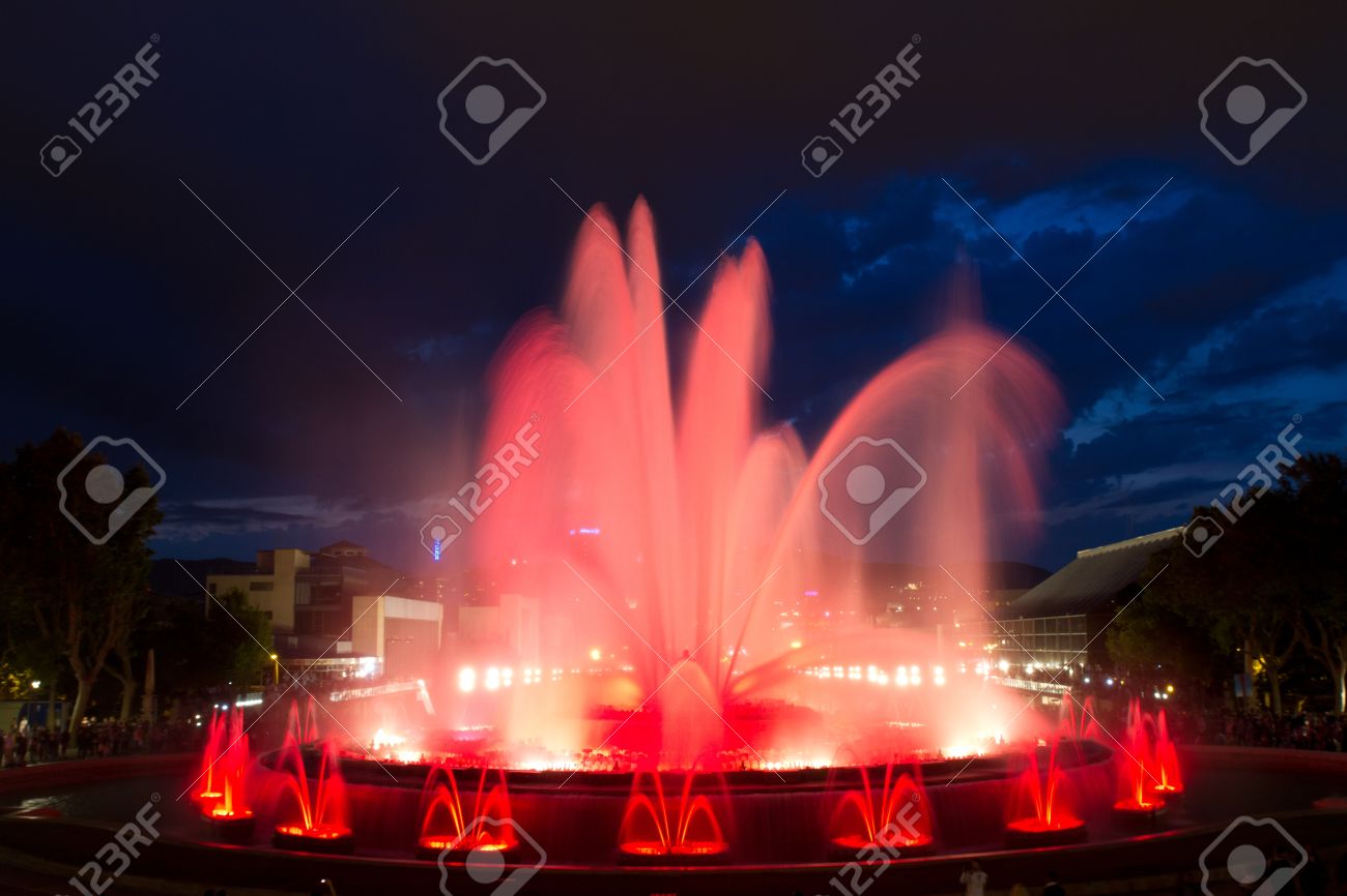 Magic Fountains With Red Lights At Night In Front Of Palau Nacional