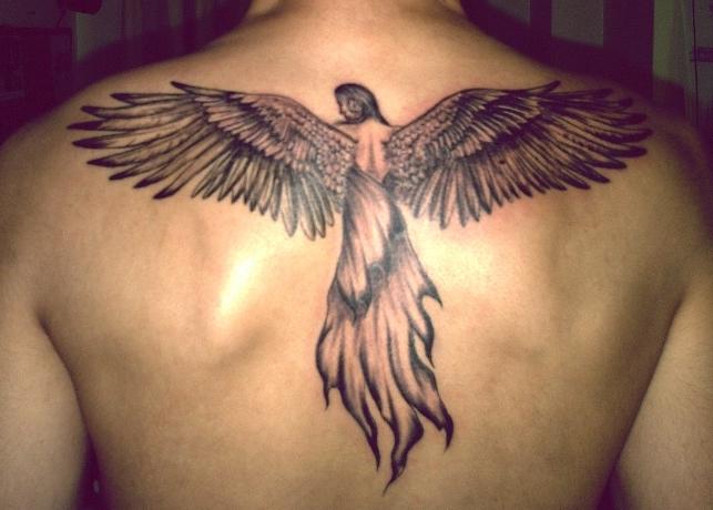 Man With Angel Tattoo On Upper Back
