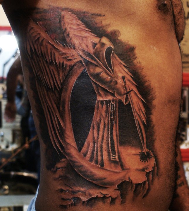 Man With Realistic Angel Tattoo On Side Rib