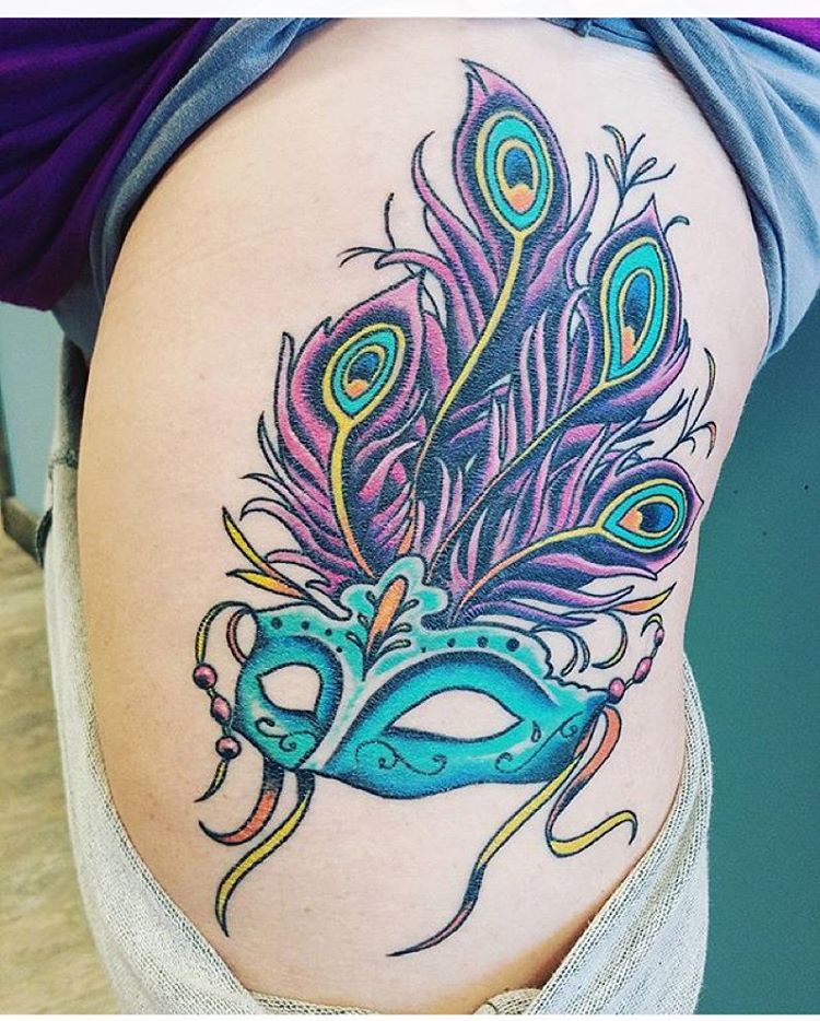Mardi Grass Mask With Peacock Feathers Tattoo On Side Thigh