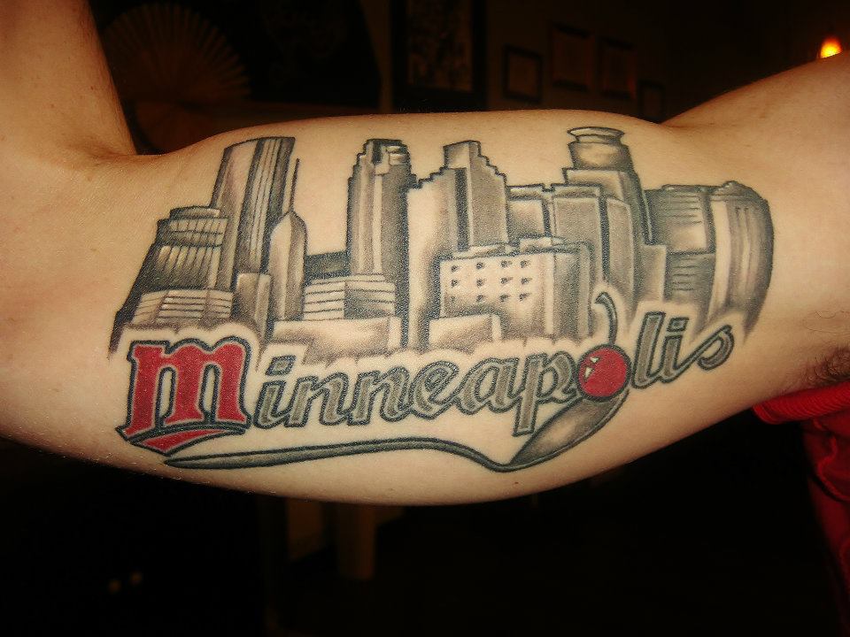 Minneapolis - Black Ink Buildings Tattoo On Bicep By Omar