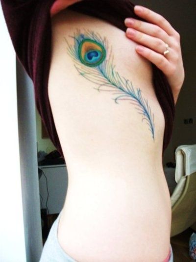 Peacock Feather Tattoo On Girl Rib Side