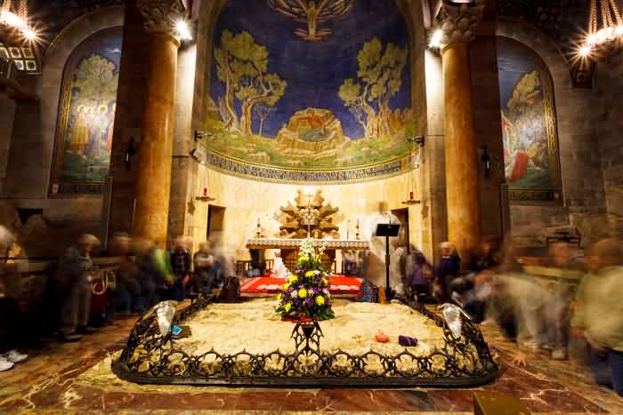 People Praying At Rock Of Agony Inside The Church Of All Nations
