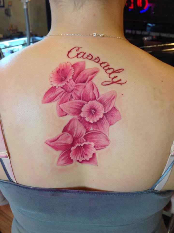 Pink Ink Daffodil Flowers Tattoo On Women Upper Back