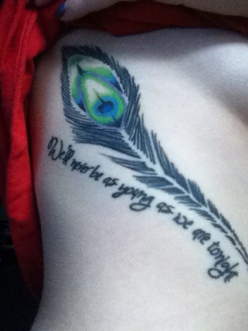Quote And Peacock Feather Tattoo On Rib Side