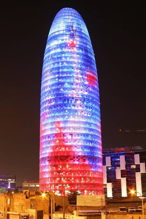 Red And Blue Lights On The Torre Agbar At Night