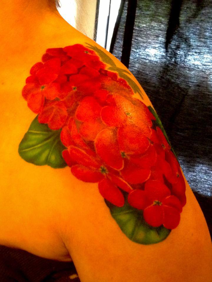 Red Ink Geranium Flowers Tattoo On Left Shoulder By Omar