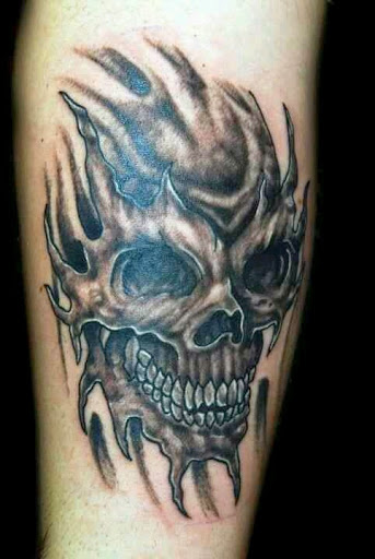Ripped Skin Grey Skull Tattoo On Arm