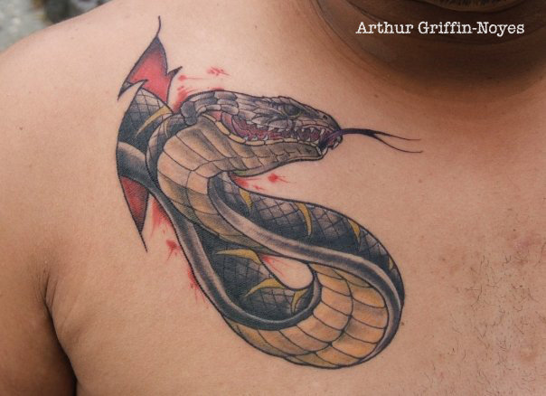 Ripped Skin Snake Tattoo On Man Right Front Shoulder