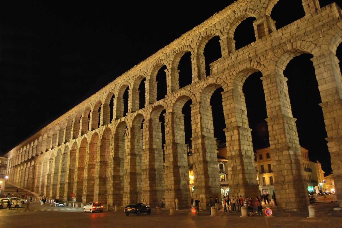 Side View Of The Aqueduct of Segovia At Night
