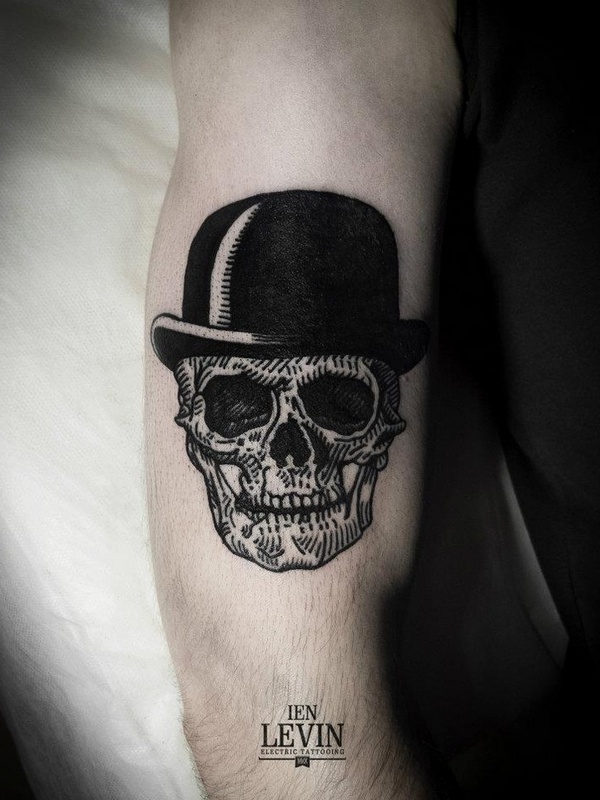 Skull With Black Hat Tattoo On Bicep