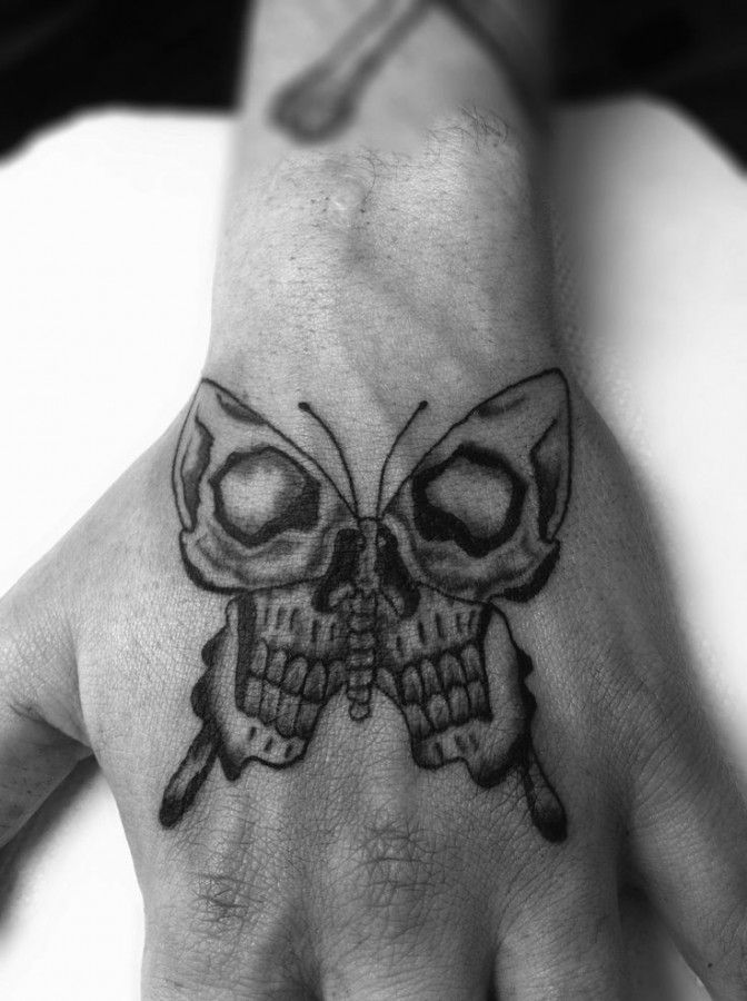 Skulls In Butterfly Tattoo On Left Hand