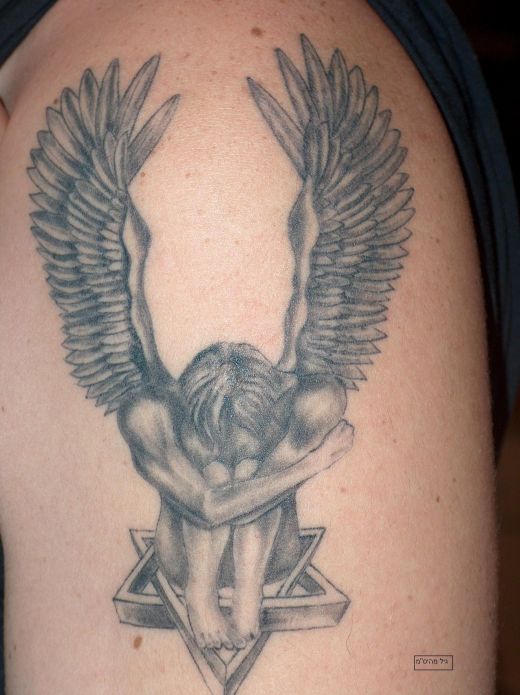 Star And Sad Angel Tattoo On Shoulder