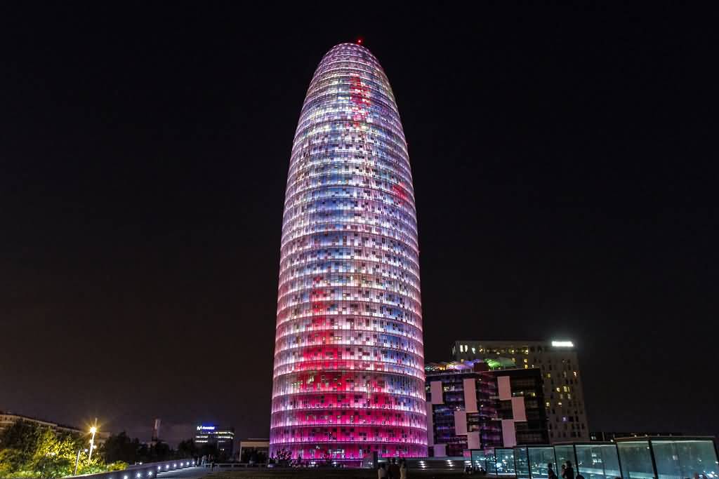 Torre Agbar Illuminated At Night