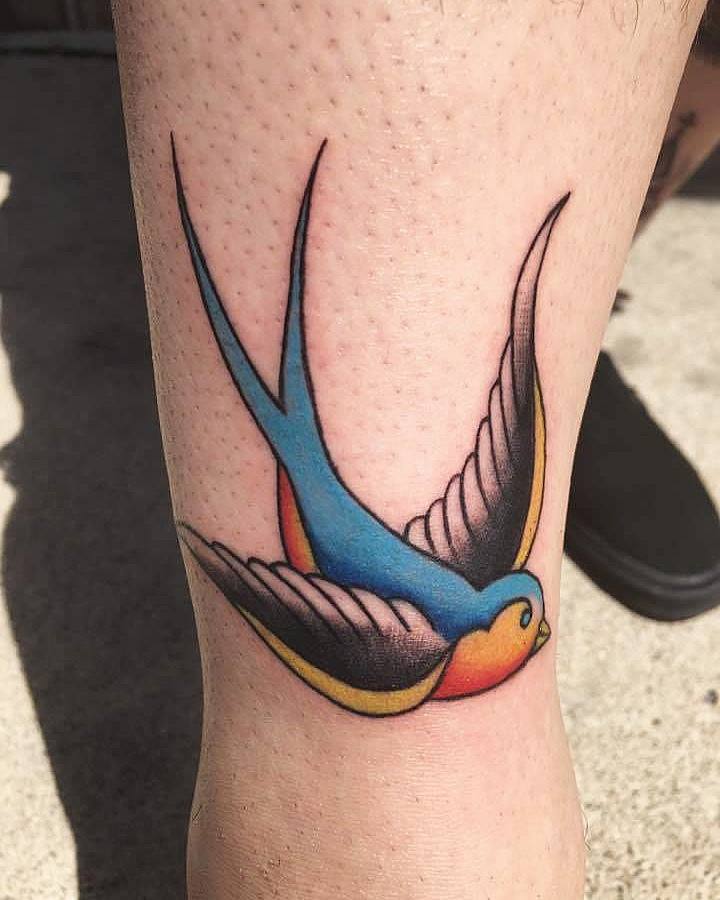 Traditional Flying Bird Tattoo On Right Leg