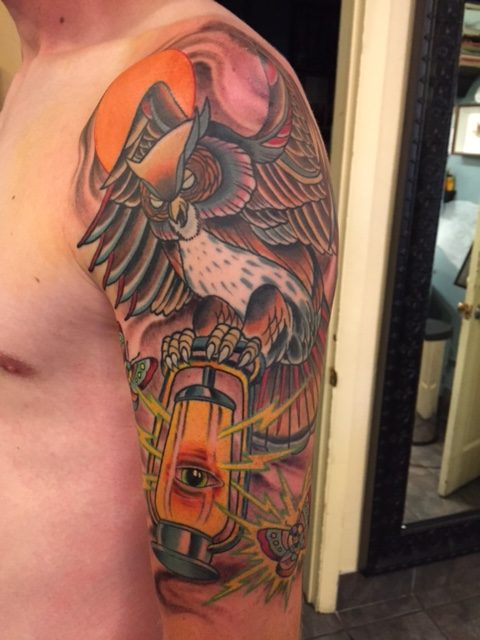 Traditional Flying Owl With Lamp Tattoo On Man Left Half Sleeve By Erick Erickson