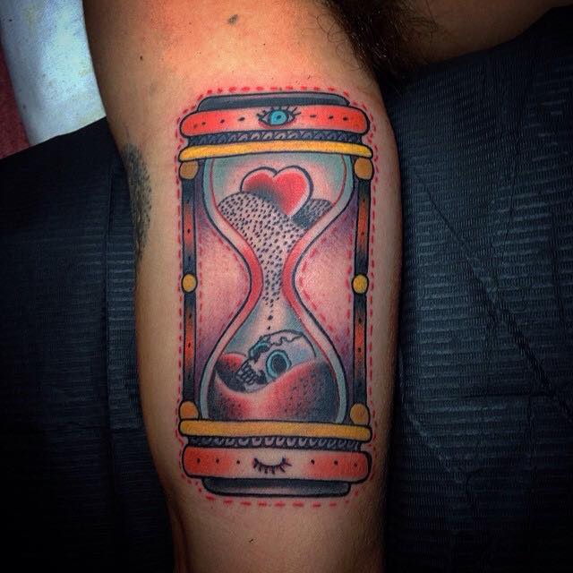 Traditional Heart And Skull In Hourglass Tattoo On Bicep By Pig Legion