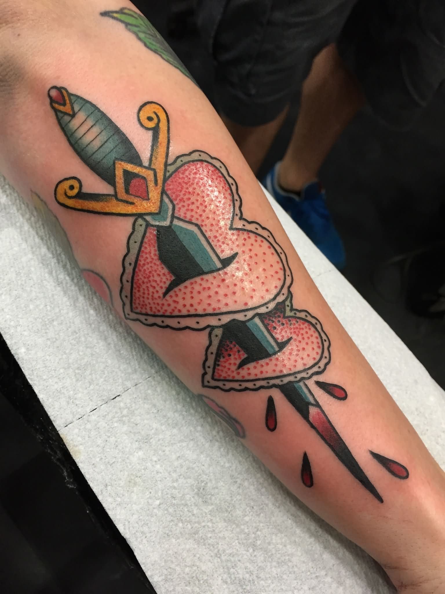 Traditional Sword In Two Hearts Tattoo On Right Arm By Kohen Meyers