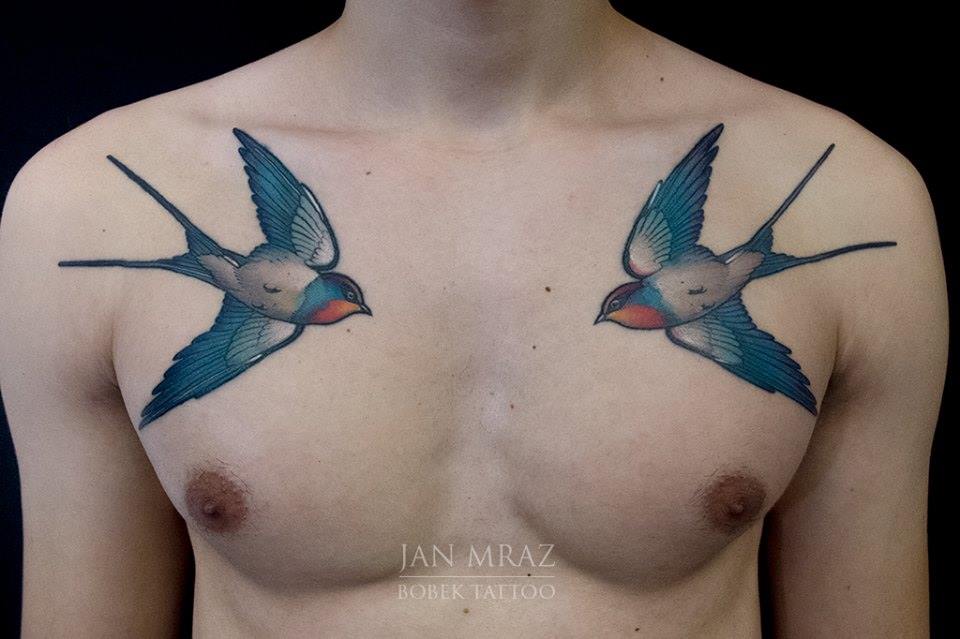Traditional Two Flying Birds Tattoo On Man Chest