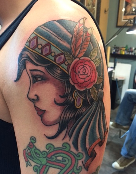 Traditional Women Face Tattoo On Man Left Shoulder