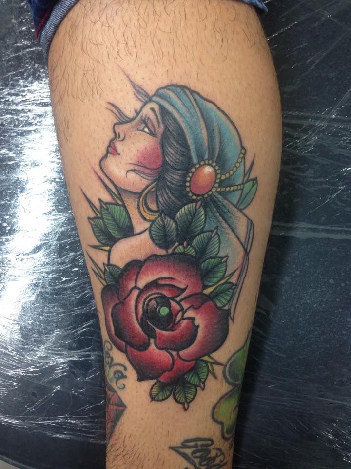 Traditional Women Head With Rose Tattoo Design For Leg By Pig Legion