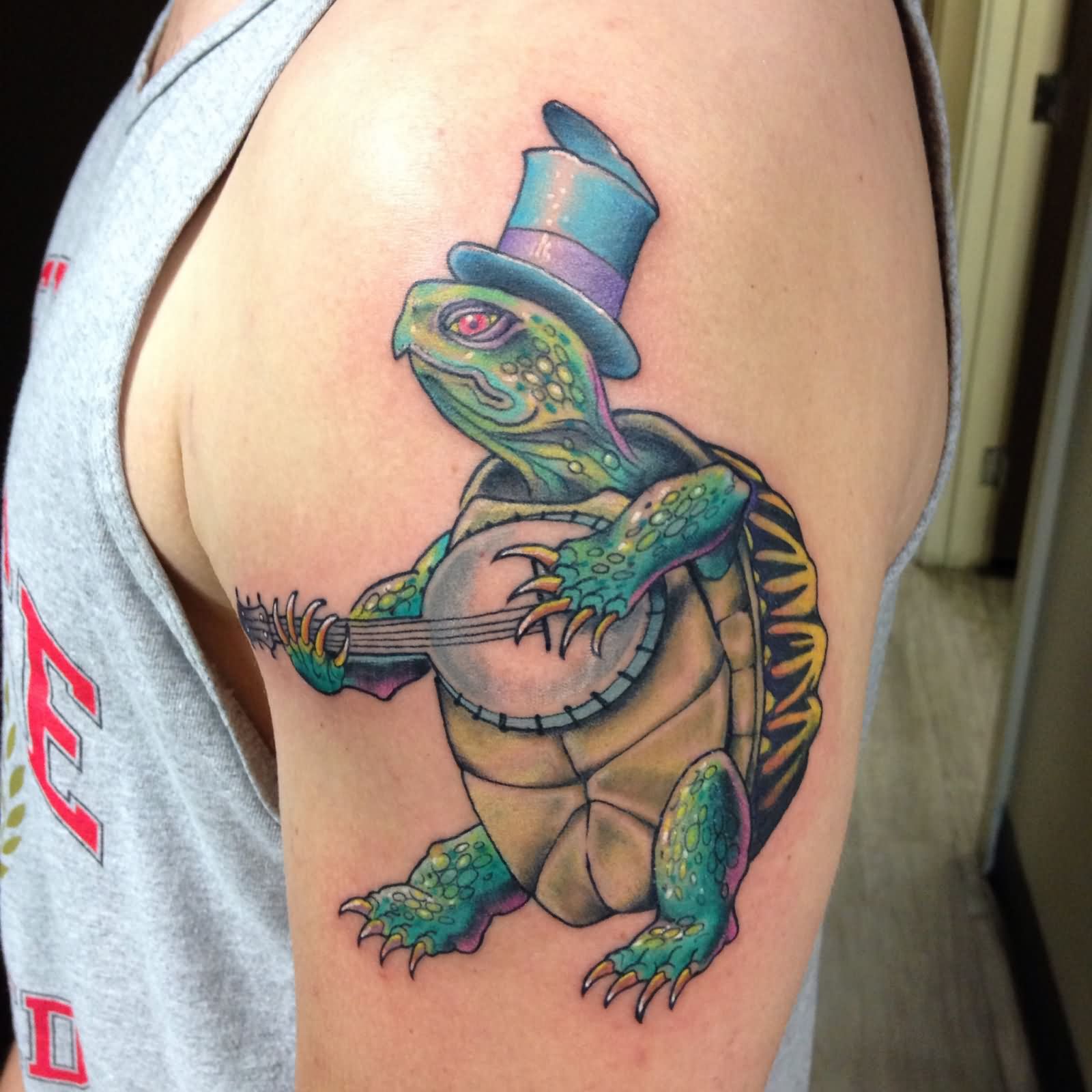 Turtle Playing Guitar Tattoo On Left Shoulder