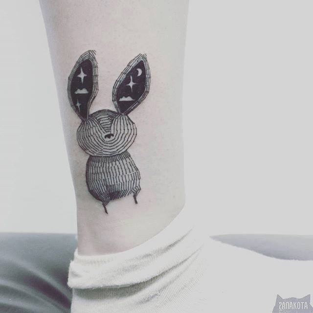 Unique Black Ink Rabbit Tattoo On Leg By Panakota
