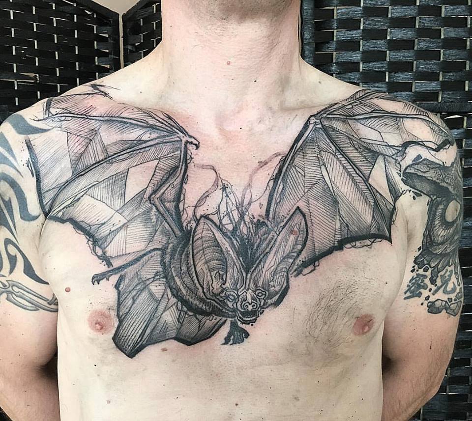 Abstract Black Ink Flying Bat Tattoo On Man Chest