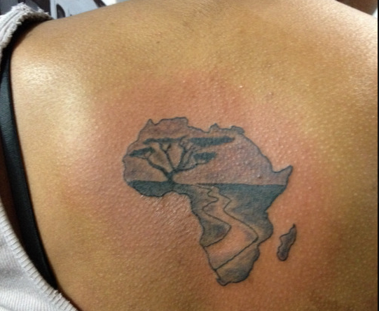 Amazing Black Ink African Map Tattoo On Women Upper Back