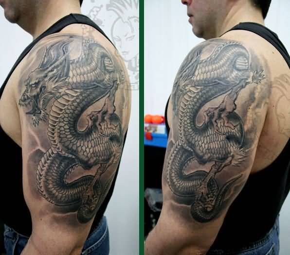 Amazing Black Ink Dragon Tattoo On Man Left Half Sleeve