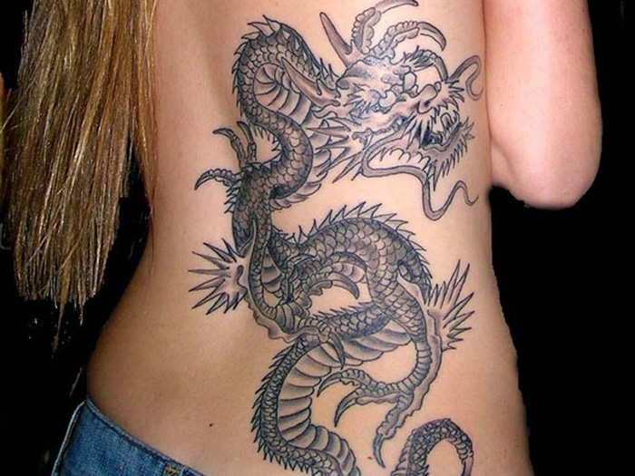 Amazing Black Ink Dragon Tattoo On Women Back