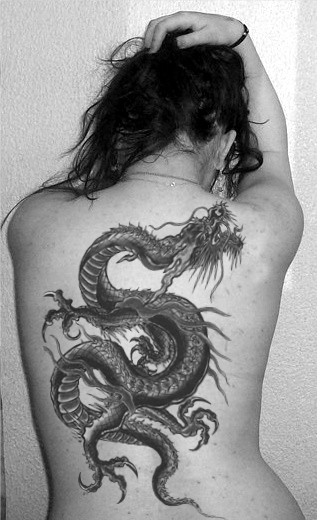 Amazing Black Ink Dragon Tattoo On Women Full Back