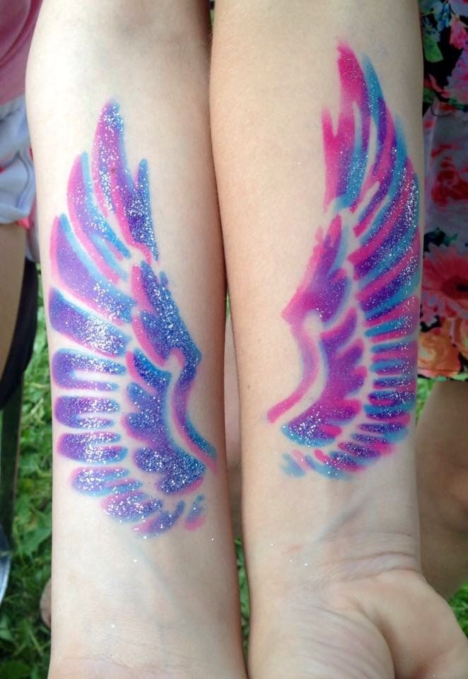 Amazing Colorful Airbrush Wings Tattoo On Forearm By by Kae Ryan