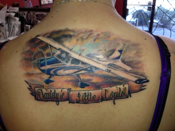 Attractive Airplane With Banner Tattoo On Women Upper Back
