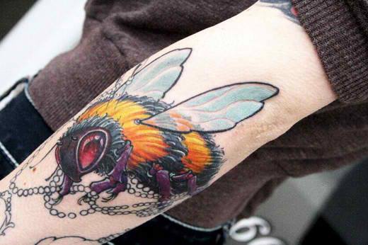 Attractive Bee Tattoo On Left Arm By Jeff Norton