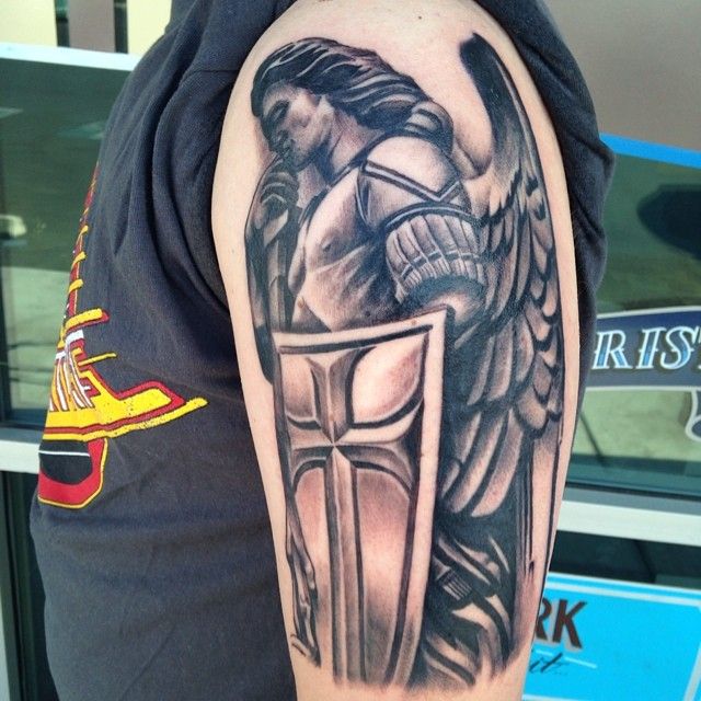 Attractive Black Ink Archangel Michael Tattoo On Man Left Half Sleeve