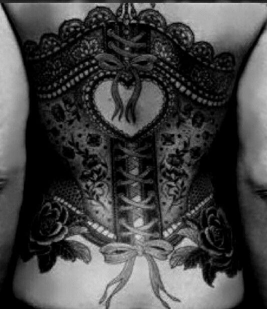 Attractive Black Ink Corset With Bow Tattoo On Women Back