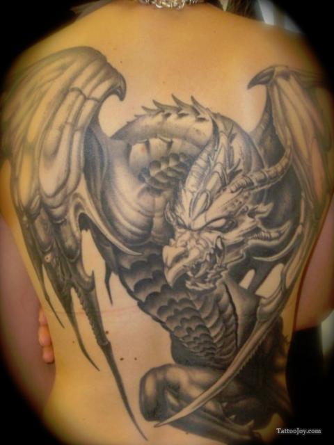 Attractive Black Ink Dragon Tattoo On Girl Full Back
