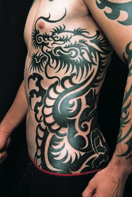Attractive Black Tribal Dragon Tattoo On Man Left Side Rib