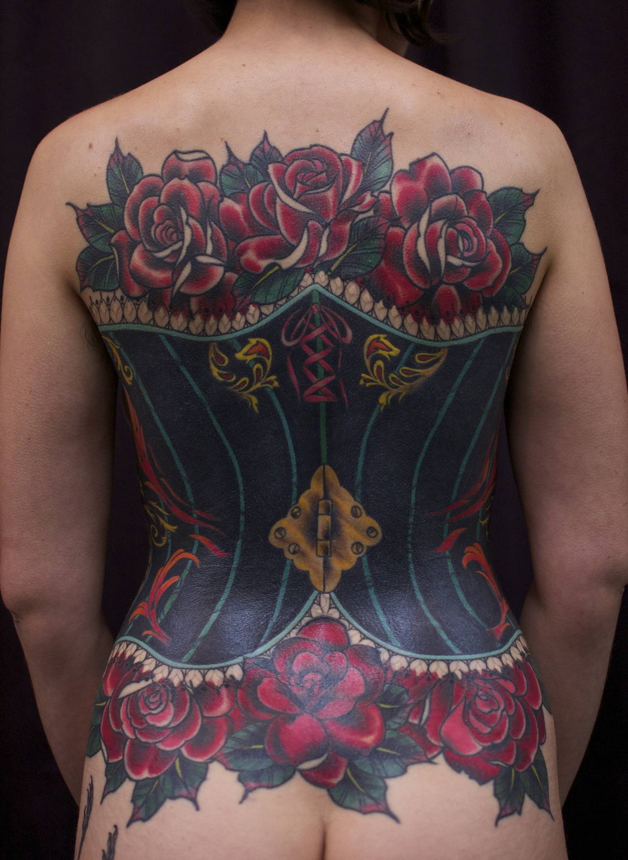Attractive Corset With Roses Tattoo On Full Back