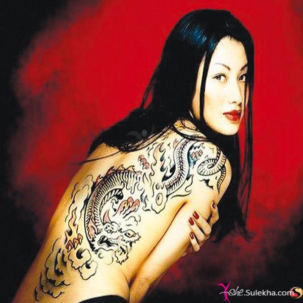 Attractive Dragon Tattoo On Women Full Back