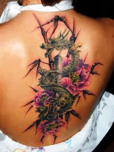 Attractive Dragon With Flowers Tattoo On Upper Back