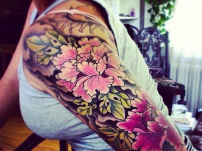 Attractive Peony Flowers Tattoo On Women Left Half Sleeve