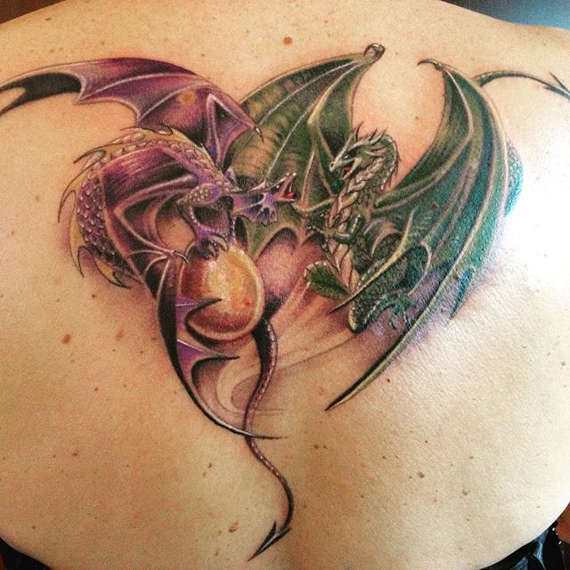 Attractive Two Dragons Tattoo On Upper Back