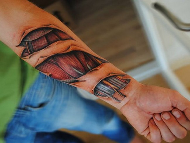 Awesome 3D Ripped Skin muscle Tattoo On Left Forearm