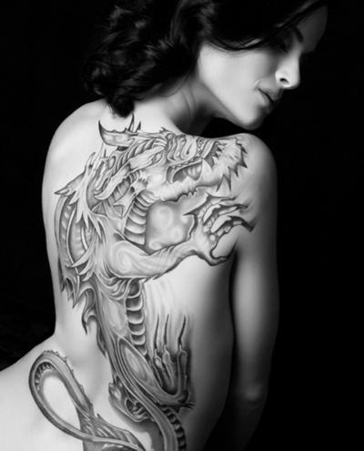 Awesome Black And Grey Dragon Tattoo On Women Full Back