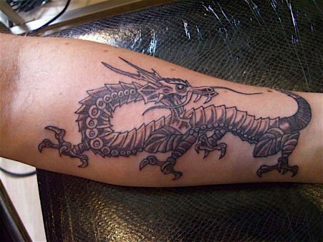 Awesome Black Ink Dragon Tattoo On Left Forearm