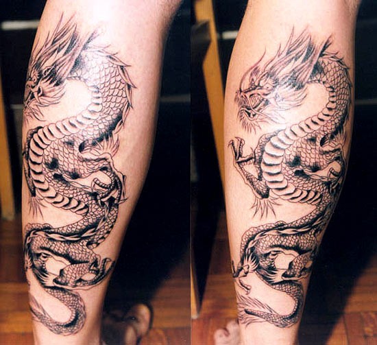 Awesome Black Ink Dragon Tattoo On Leg Calf